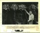 1988 Press Photo Thomas Manson waters plants at 510 Hemlock street in LaPlace